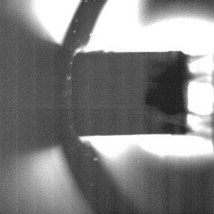 A 16 mm neon–deuterium pellet, indicated by an arrow, captured with a high speed camera as it travels from left to right at about 300 meters per second in a test stand at the Oak Ridge National Laboratory Pellet Lab.