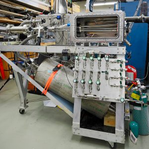 3 barrel shattered pellet injector prototype installed in an open vacuum box in the pellet lab at ORNL.
