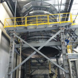 The reaction heat treatment furnace is shown opened up; the upper portion will descend when a module is inside. Photo: US ITER