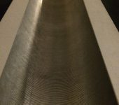 Evacuated wave guide with fine corrugations