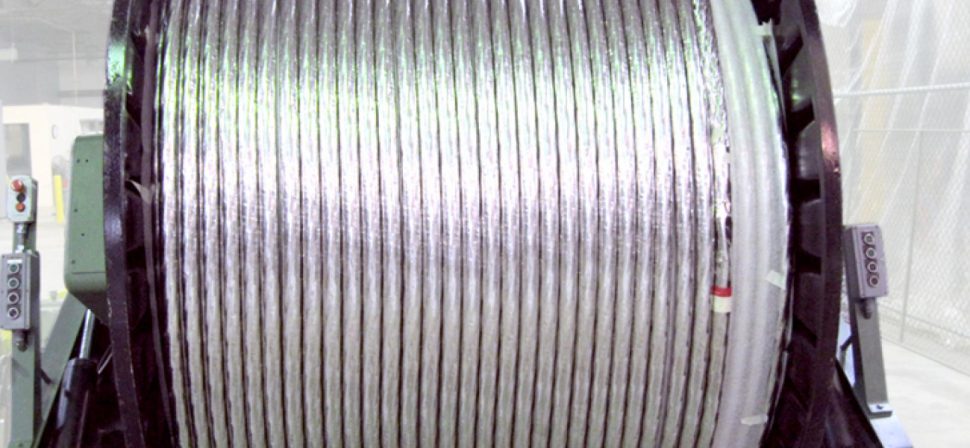 Superconducting strand is cabled at New England Wire Technologies on 2.5 meter wide by 2 meter tall spools before shipment to Florida for conductor jacketing.