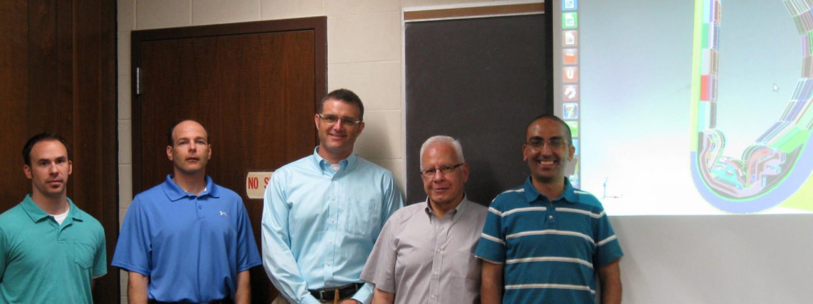 A neutronics model of ITER is behind (left to right) Ed Marriott, Tim Bohm, Paul Wilson, Mohamed Sawan and Ahmad Ibrahim, US ITER researchers at the University of Wisconsin.