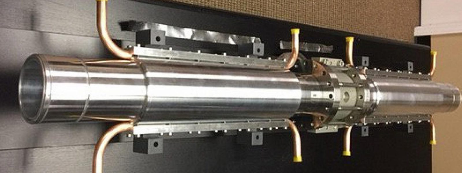 The electron cyclotron transmission lines feature multiple lines of aluminum waveguides (two small-scale prototypes are pictured).